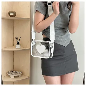 Borsa a tracolla in PVC trasparente con motivo a cuore bianco e tracolla regolabile
