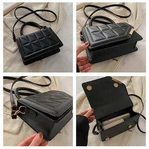 Détails du sac matelassé noir avec finitions dorées et poignée tressée élégante