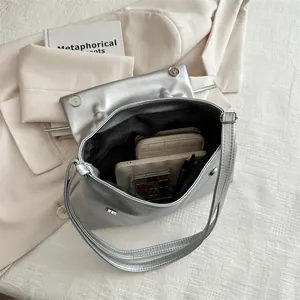 Silver metallic shoulder bag with large interior space for phone and wallet essentials