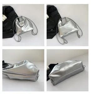 Detail views of silver PU leather bag with metallic finish and bow hardware ornament