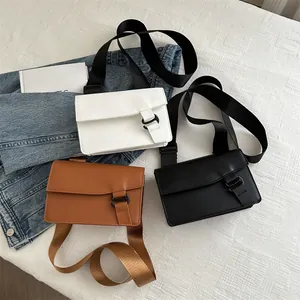 Minimalist square crossbody bags with wide straps in white, black, and brown faux leather