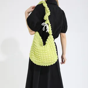 Bright chartreuse bubble textured shoulder bag with stylish white bow detail