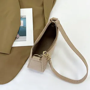 Minimalist khaki felt underarm bag with pleated details and golden chain strap