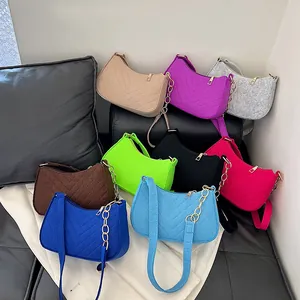 Minimalist felt underarm bags for women with V-shaped quilting in various vibrant colors
