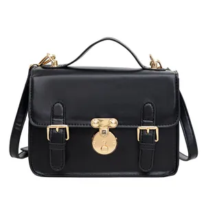 Classic black French style messenger bag with gold lock and top handle for women