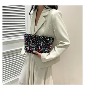 Macro view of a colorful sequined clutch bag highlighting texture and rectangular design