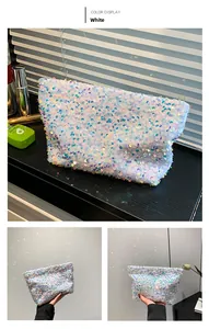 Detailed view of iridescent white sequin makeup bag with gold zipper and shiny finish