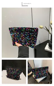 Detail of multicolor sequin makeup bag showing trapezoid shape and metal zipper