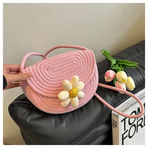 Detailed pink woven cotton shoulder bag with 3D daisy flower and cute smiley face center