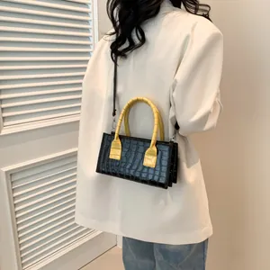 Borsa a mano con motivo pietra, manici gialli e tracolla nera rimovibile