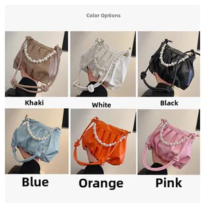Color display of pleated cloud bags with pearl handles in six various stylish shades