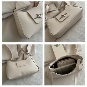 Détails du sac crème avec boucle étoilée en argent et bandoulière réglable