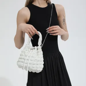 Chic white bubble textured bucket bag with drawstring and silver chain strap for women