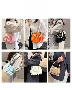 Ruched cloud bag detail showing pearl chain and six versatile color options in daily use