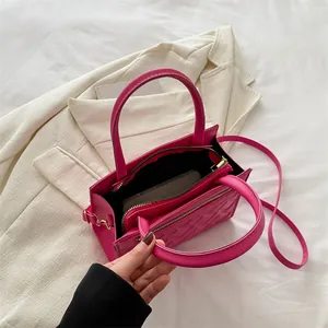Chic magenta quilted handbag with top handles and adjustable strap for women