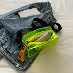 Neon green transparent PVC crossbody bag with MINI GIRL text and adjustable black strap