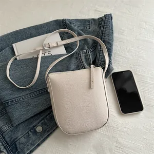 Minimalist cream white lychee grain mini crossbody bag with U-shaped design for women