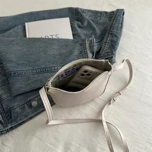 Minimalist beige lychee texture crossbody phone bag for women with adjustable strap
