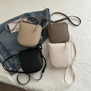 Minimalist litchi grain crossbody bag for women in four versatile colors and textures