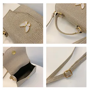 Détails du sac pailleté champagne avec décor papillon, boucle et compartiment interne