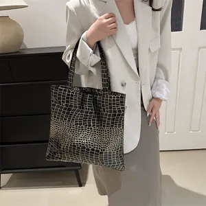 Fashionable black crocodile embossed tote bag with glossy finish and large capacity