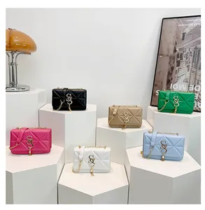 Six colors of quilted crossbody bags with chain straps on white podiums