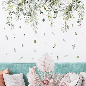 Watercolor botanical wall stickers with green vines and pink flowers in a Nordic living room