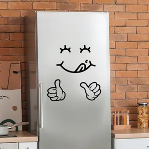 Funny smiling face wall sticker with thumbs up gesture on a silver refrigerator