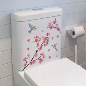 Stickers muraux fleurs et oiseaux sur réservoir de toilettes blanc avec colibris