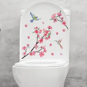 Sticker floral autocollant avec fleurs de pêcher et oiseaux sur couvercle de toilette