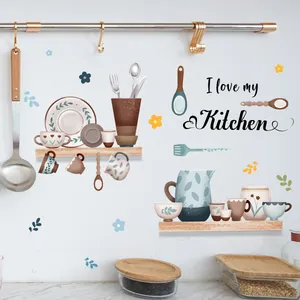 Detail of kitchen wall sticker with cups and I love my Kitchen text on white tiles