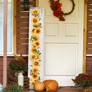 Tall wooden porch sign featuring sunflowers and butterflies against a rustic white wood background