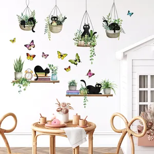 Detail of creative black cat and plant wall stickers on a modern minimalist white wall