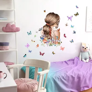 Detail of girl and colorful butterflies wall decals applied on a bedroom wall