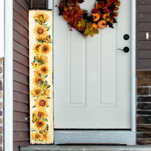Vertical sunflower and butterfly wall decor board placed next to an entrance door