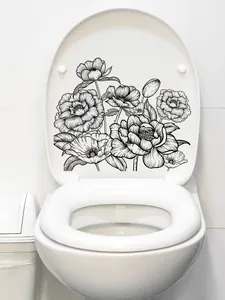 Detail of black and white floral line art sticker on white toilet lid interior