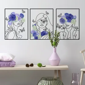 Three-piece modern wall art set featuring abstract female portraits with blue roses and butterflies