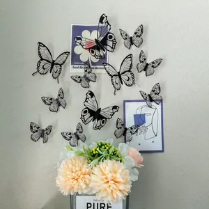 Detailed view of 3D black and white butterfly wall stickers with adjustable wings