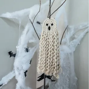 Handmade Macrame Halloween ghost wall hanging with decorative spider web background