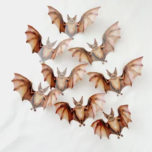 Detailed view of 8 vintage brown 3D bat wall stickers with realistic textures on white