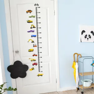 Detail of colorful cartoon car height chart stickers showing 50-180cm scale on a white door