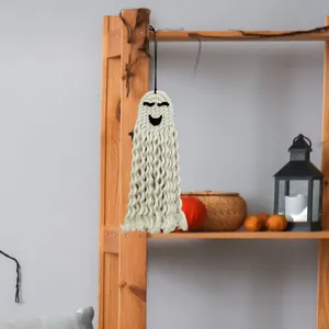 Handcrafted Macramé Halloween ghost wall hanging with fringe details and pumpkin decor