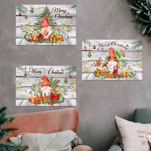 Three-piece set of Christmas gnomes and tree wall art on vintage wood background