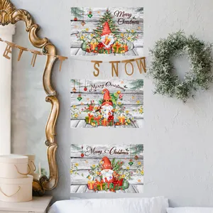 Detailed trio of Christmas gnome posters on white wood texture hung on grey wall decor
