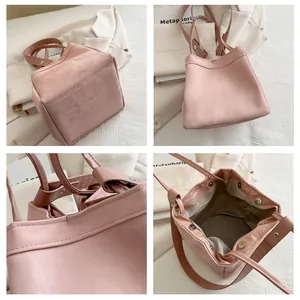 Détails du sac seau rose montrant les boucles magnétiques et la doublure intérieure grise