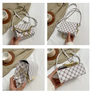 Detailed close-up of retro geometric print mini bag with gold chain and hardware