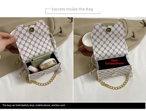Internal view of a vintage pattern crossbody bag showing storage capacity and chain strap