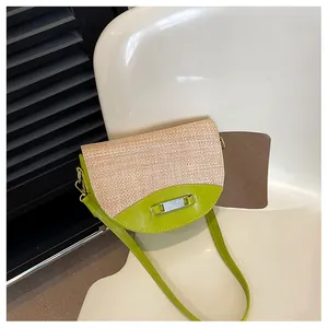 Detail of lime green leather and woven straw texture on a stylish saddle bag