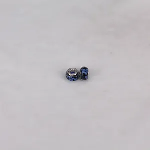 Detailed close-up of 14mm resin glass charm with S925 silver core and blue floral pattern