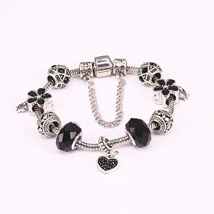 European style silver snake chain bracelet with black faceted beads and heart pendant